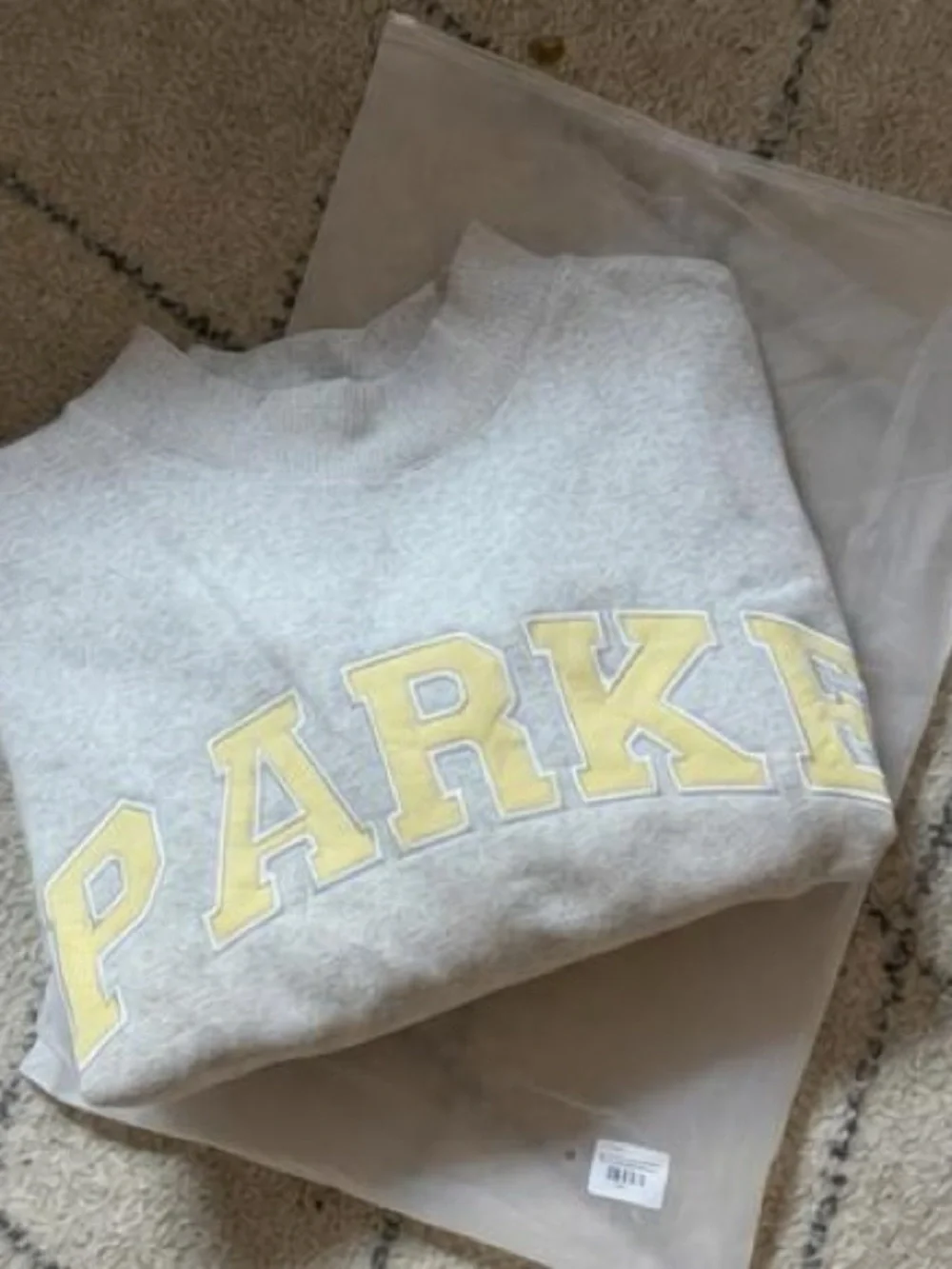 Parker Light Gray Crewneck Sweatshirt with Pale Yellow Appliqué